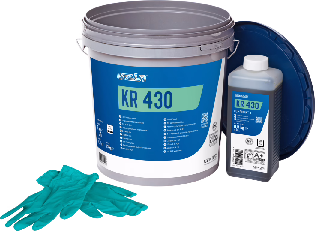 UZIN_Dummy_KR 430-8kg_2025-07 A large gray plastic bucket labeled 'KR 430' with a blue-and-green label, shown alongside a smaller bottle labeled 'KR 430 Component B' and a pair of teal disposable gloves; packaging for a two-component polyurethane adhesive.